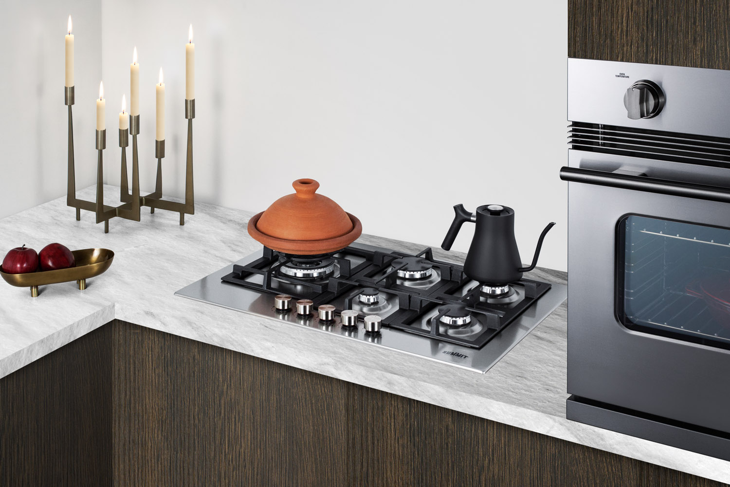 4-burner LP gas cooktop made in Italy with sealed burners, multiple heating outputs, a 304 grade stainless steel surface, and continuous cast iron grates for added durability